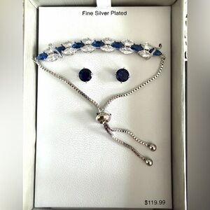 Silver plated blue and clear cubic zirconia bracelet and earring set.